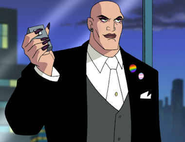 Edit of Lex Luthor from the animated Justice League tv show. He is holding a device with a button on it in his right hand. He is wearing dark makeup, with dark purple eyeshadow and lipstick. He has dark purple acrylic nails and is wearing trans and gay pride pins on his suit.