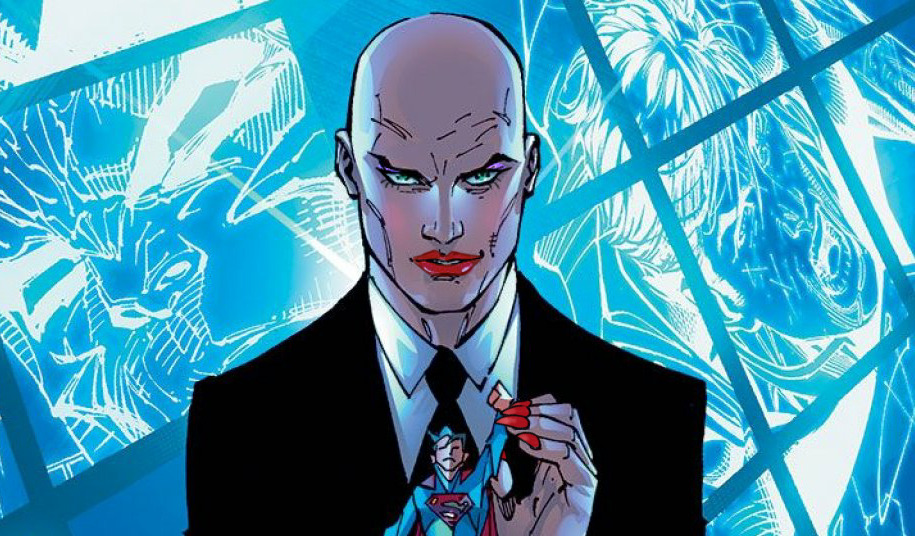 Comic edit of Lex Luthor, who is a bald white man in a suit. He is holding a figurine of Superman. He is wearing makeup and red acrylic nails.